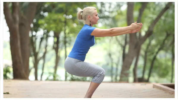 Chair pose works thighs, calves, and core