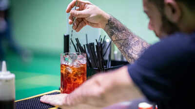 Person pondering the effects of mixing drinks.