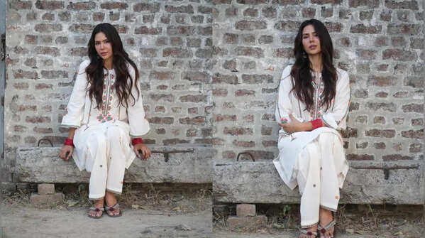 Elegant white suit with vibrant floral embroidery