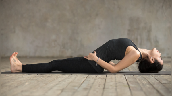 Woman demonstrating Matsyasana, fish pose