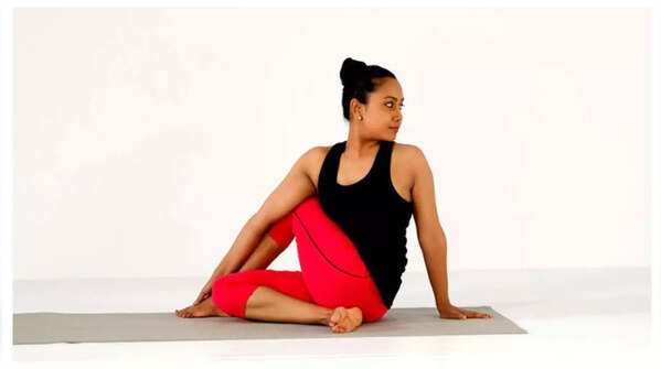 Practicing Ardha Matsyendrasana or Seated Spinal Twist