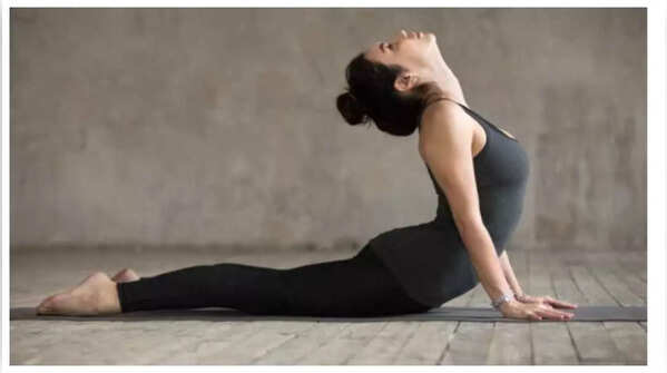 Performing Bhujangasana or Cobra Pose