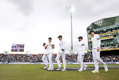 Ben Stokes leads England onto the field