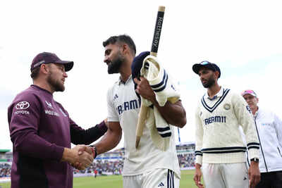 Akash Deep and Brendon McCullum shake hands after India's victory.