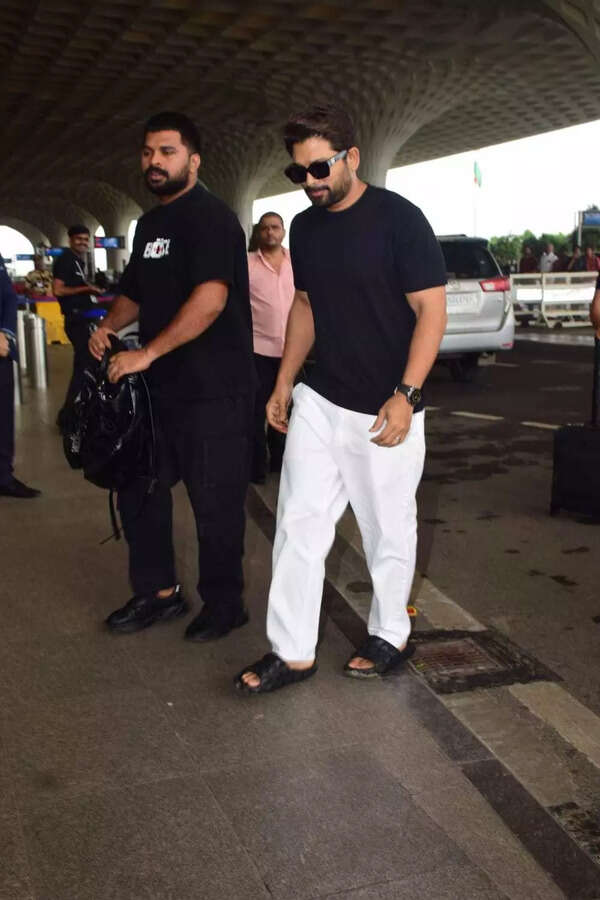 Allu Arjun removes sunglasses at security check.